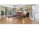 Inviting living room featuring hardwood floors, large windows, and comfortable seating with ornate decor at 1080 Ithaca Dr, Boulder, CO 80305