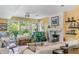 Comfortable living room boasts a fireplace, tv, large windows, and cozy seating at 1080 Ithaca Dr, Boulder, CO 80305