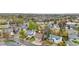 Scenic aerial view of a home and neighborhood with mature trees and well-kept lawns in a residential area at 9960 Garland Ln, Broomfield, CO 80021