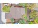 Aerial view of a home with a spacious backyard and a covered patio area, highlighting its layout at 9960 Garland Ln, Broomfield, CO 80021