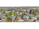 Scenic aerial view of a home and neighborhood with mature trees and well-kept lawns in a residential area at 9960 Garland Ln, Broomfield, CO 80021