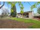 Spacious backyard with a covered patio, perfect for outdoor gatherings and activities at 9960 Garland Ln, Broomfield, CO 80021