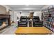 Finished basement boasts cozy fireplace, entertainment area, and stylish leather recliners at 9960 Garland Ln, Broomfield, CO 80021