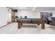 Finished basement with pool table, bar seating, and entertainment space at 9960 Garland Ln, Broomfield, CO 80021
