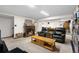 Finished basement with fireplace, leather furniture, and billiards table at 9960 Garland Ln, Broomfield, CO 80021