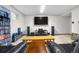 Entertainment basement features large TV, surround sound and media storage at 9960 Garland Ln, Broomfield, CO 80021