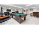 Basement offers a pool table with seating, bar and entertainment space at 9960 Garland Ln, Broomfield, CO 80021