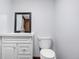 Powder room with modern vanity, stylish mirror, and updated fixtures at 9960 Garland Ln, Broomfield, CO 80021