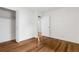 Bedroom featuring hardwood floors, large window and double closet at 9960 Garland Ln, Broomfield, CO 80021