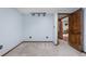 Cozy bedroom with warm lighting and a wooden door leading to an adjacent room at 9960 Garland Ln, Broomfield, CO 80021
