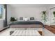 Bedroom with neutral decor, a sliding mirror closet, and hardwood floors at 9960 Garland Ln, Broomfield, CO 80021