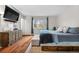 Bedroom with tv, hardwood floors, natural light and neutral decor at 9960 Garland Ln, Broomfield, CO 80021