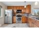 Traditional kitchen with stainless steel appliances, and granite counters at 9960 Garland Ln, Broomfield, CO 80021