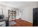 Office space with hardwood floors and built-in shelving at 9960 Garland Ln, Broomfield, CO 80021