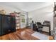 Bright office area features wood flooring, a safe, shelving and a window at 9960 Garland Ln, Broomfield, CO 80021