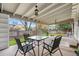 Charming covered patio area with outdoor seating overlooking the landscaped backyard at 9960 Garland Ln, Broomfield, CO 80021