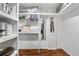 Organized walk-in closet with ample shelving and rod space, designed for optimal storage solutions at 9960 Garland Ln, Broomfield, CO 80021