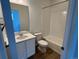 Clean bathroom featuring a vanity, toilet, and shower-tub combo at 6601 N Netherland St, Aurora, CO 80019