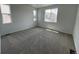 Spacious carpeted bedroom featuring two windows that provide plenty of natural light at 6601 N Netherland St, Aurora, CO 80019