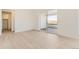 Bright bedroom with light wood floors, closet, and sliding glass door to the patio at 907 Congress Pl, Elizabeth, CO 80107