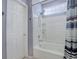 Bathroom featuring a white bathtub-shower, white tiles, and a decorative shower curtain at 4211 Miners Candle Pl, Castle Rock, CO 80109