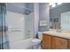 Bathroom featuring a combined shower and bathtub, with a single vanity and a decorative sign at 4211 Miners Candle Pl, Castle Rock, CO 80109