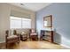 Bright bedroom featuring hardwood floors, a window, and stylish, comfortable furniture at 4211 Miners Candle Pl, Castle Rock, CO 80109