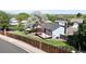 Aerial view showcasing a backyard oasis with patio shade, lush landscaping and fencing at 10950 Tennyson Ct, Westminster, CO 80031