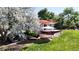 Backyard showcasing patio with shade sail and lush landscaping at 10950 Tennyson Ct, Westminster, CO 80031
