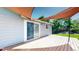 Backyard deck featuring a sliding glass door and shade for enjoyable outdoor living and entertaining at 10950 Tennyson Ct, Westminster, CO 80031