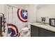 Bathroom with a Captain America theme, a granite countertop, and an undermount sink at 23545 E Platte Dr # C, Aurora, CO 80016