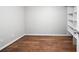 Neutral basement with wood floor and shelving at 401 S Williams St, Denver, CO 80209