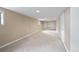 Spacious basement with neutral walls, carpeted floor and built in wall shelving at 401 S Williams St, Denver, CO 80209