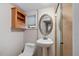 Well-lit bathroom with modern fixtures, a pedestal sink, and a glass-enclosed shower at 401 S Williams St, Denver, CO 80209