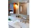 Updated bathroom featuring a modern sink, tiled backsplash, and stylish vanity at 401 S Williams St, Denver, CO 80209