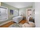 Cozy bedroom with hardwood floors, a neutral color palette, and natural light at 401 S Williams St, Denver, CO 80209