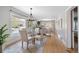 Open dining area with a view into the living room and hardwood floors throughout at 401 S Williams St, Denver, CO 80209