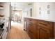 The kitchen features stainless steel appliances, white cabinets, a center island, and access to the dining room at 401 S Williams St, Denver, CO 80209