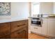 The kitchen features stainless steel appliances, white cabinets, granite countertops and hardwood floors at 401 S Williams St, Denver, CO 80209