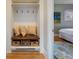 Convenient mudroom area with built-in bench, hooks, and storage baskets, leading to bedroom at 401 S Williams St, Denver, CO 80209