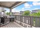 Inviting outdoor balcony with wicker chairs and neighborhood views at 2395 S Troy Ct, Aurora, CO 80014