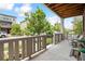 Inviting covered front porch featuring a concrete floor, wood ceiling, and cozy seating area to enjoy outdoor living at 2395 S Troy Ct, Aurora, CO 80014