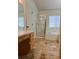 Main bathroom with double vanity, shower and separate tub at 4452 S Auckland Ct, Aurora, CO 80015