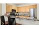 Kitchen with granite countertops and stainless steel appliances at 4452 S Auckland Ct, Aurora, CO 80015