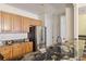 Kitchen with granite countertops and stainless steel fridge at 4452 S Auckland Ct, Aurora, CO 80015