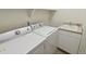 Laundry room with washer, dryer, and utility sink at 4452 S Auckland Ct, Aurora, CO 80015