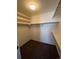 Spacious walk-in closet with double hanging rods and shelving at 4452 S Auckland Ct, Aurora, CO 80015