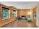 Basement room featuring wood paneled walls and windows that let in natural light at 10436 Jeanette Ct, Morrison, CO 80465