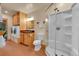 Bathroom with a modern shower, sink, and laundry area at 10436 Jeanette Ct, Morrison, CO 80465