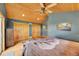 Bedroom with vaulted wood ceilings, a ceiling fan, and a large bed at 10436 Jeanette Ct, Morrison, CO 80465